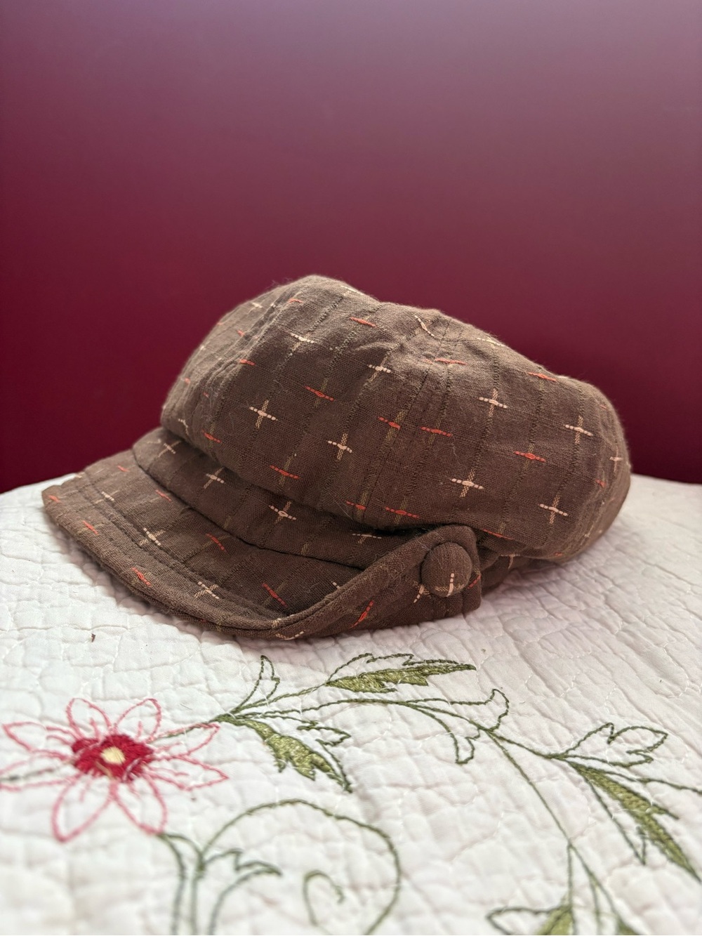 Brown Newsboy Cap with Cross-Stitch Detail